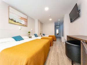 Postel nebo postele na pokoji v ubytování Dormavalencia Hostel Regne