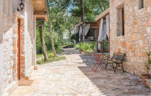 a patio with a table and chairs next to a building at Olive in Rovinj