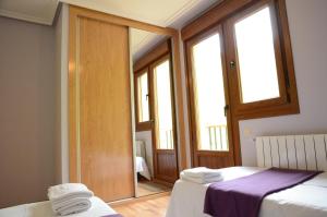 Postel nebo postele na pokoji v ubytování Apartamentos el Rincon de Limes