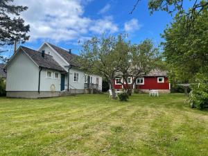 a view of a house and a yard at 4 person holiday home in KÖPINGSVIK in Köpingsvik