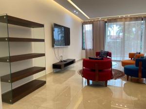 Televizorius ir (arba) pramogų centras apgyvendinimo įstaigoje Franyah résidence dar 6 nuotraukos