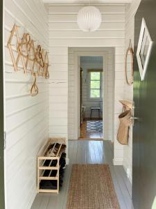 a hallway of a house with white walls at Fine Details In Forest Setting In Ebeltoft in Ebeltoft