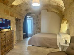 Posteľ alebo postele v izbe v ubytovaní Albergo Diffuso Monopoli