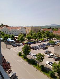 an aerial view of a parking lot with cars parked at Stan na dan in Ljubuški