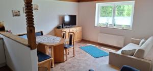 Televízia a/alebo spoločenská miestnosť v ubytovaní Chalet Anna Appartment
