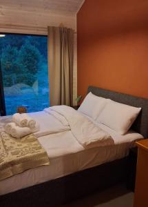 Postel nebo postele na pokoji v ubytování Getlost cabins