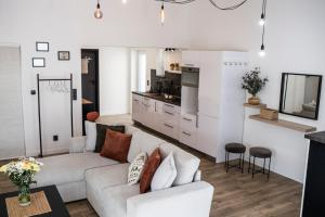 a living room with a couch and a kitchen at MFapartments in Vrbovec