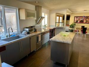 a kitchen with a sink and a counter top at Room in Bay Park, San Diego in San Diego
