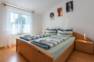 Postel nebo postele na pokoji v ubytování Mitros Apartment