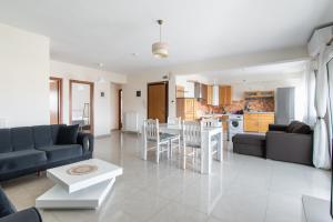a living room with a couch and a table at 3 Bedroom Apartment, Easy Parking in Alexandroupoli