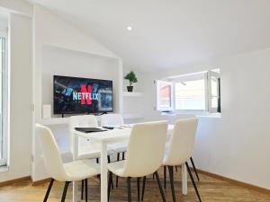 a white dining room with a white table and white chairs at HomeHolidaySanremo - Luxe & Glamour in Sanremo +36 photos
