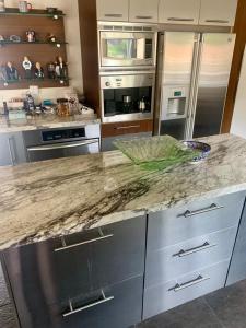 a kitchen with stainless steel appliances and a granite counter top at Room in Bay Park, San Diego in San Diego