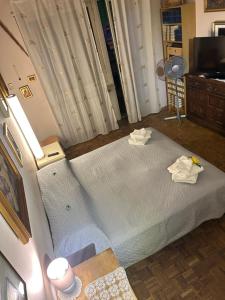 Postel nebo postele na pokoji v ubytování camera Santa Rita