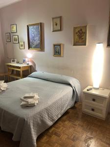 Postel nebo postele na pokoji v ubytování camera Santa Rita