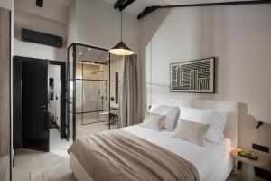 a bedroom with a large bed and a bathroom at Casa Olivetta in Visočane +19 photos