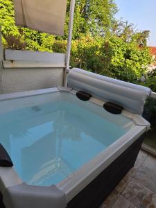 a hot tub sitting on top of a patio at Ferienwohnung Kempten (Allgäu) in Kempten