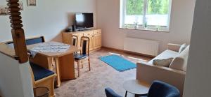 Televízia a/alebo spoločenská miestnosť v ubytovaní Chalet Anna Appartment