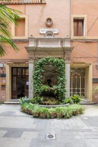 a building with a fountain in front of a building at Antiqua Domus in Rome