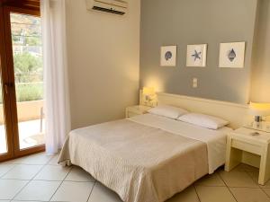 Ένα ή περισσότερα κρεβάτια σε δωμάτιο στο Platanias Memories Studio 3