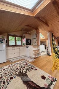 a large kitchen with a ceiling with a skylight at Outstandingfree in Holzleiten +20 photos