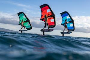 a group of people on surfboards on the water at Dos Mares Barefoot Luxury in El Cuyo