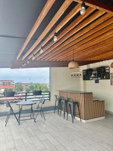a patio with a table and chairs in a building at Empire M in Kinshasa