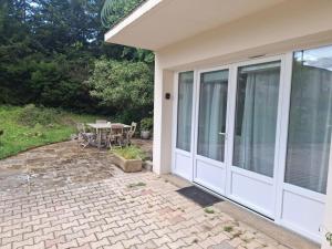 a white door of a house with a table at Charmant studio in Russan