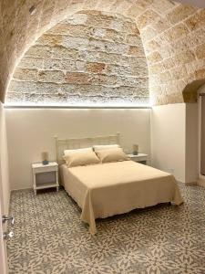 Postel nebo postele na pokoji v ubytování Dimora Donna Lucia