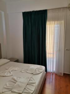 Fotografie z fotogalerie ubytování Koli Apartments v destinaci Ksamil + 26 fotografií