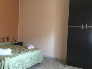 Ένα ή περισσότερα κρεβάτια σε δωμάτιο στο Holidays in Cilento +21 φωτογραφίες