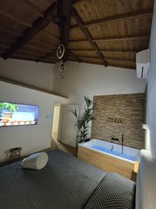 a bedroom with a bed and a bath tub at Villa Joy Verona - Lovely Suite in Verona