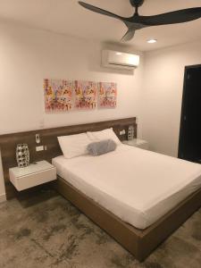 a bedroom with a large bed with a ceiling at Luxury 3br Private Rooftop in Medellín