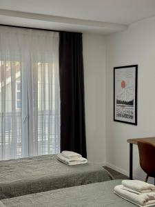 Postel nebo postele na pokoji v ubytování Fole Apart Hotel