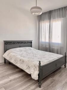 a bed in a bedroom with a large window at Thomas House on Train Tracks in Venice +13 photos