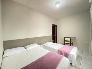 Postel nebo postele na pokoji v ubytování Pousada DONA LÍDIA