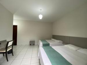 Postel nebo postele na pokoji v ubytování Pousada DONA LÍDIA