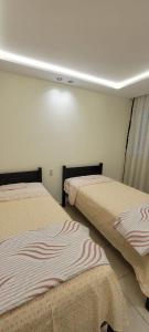 a room with two beds in a room at Precioso apartamento en el marjane in Tetouan +5 photos