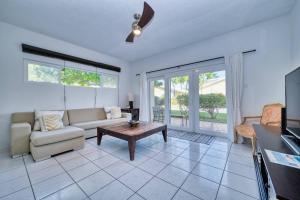 a living room with a couch and a table at Quiet Beach Escape in George Town