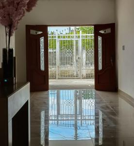an open door with a gate in a room at Chazze House in Santa Marta