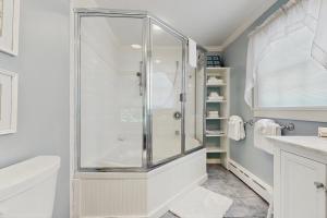 a bathroom with a shower and a toilet at The Village House in Manchester +18 photos