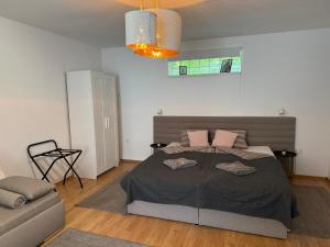 Postel nebo postele na pokoji v ubytování Corte Apartman