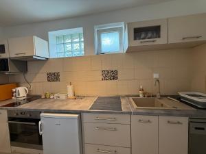 Kuchyň nebo kuchyňský kout v ubytování Corte Apartman