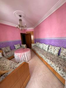 Ένα ή περισσότερα κρεβάτια σε δωμάτιο στο Apartamento en el corniche de martil