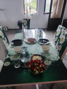 a table with a bowl of food on top of it at The Byala Escape, Private Villa with Bar & Hot Tub in Byala