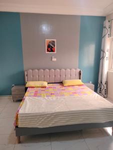 Ein Bett oder Betten in einem Zimmer der Unterkunft Résidence Diakhaby