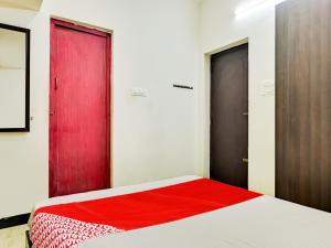 Postel nebo postele na pokoji v ubytování Hotel O A K residency