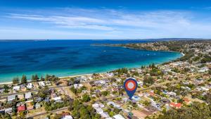 an aerial view of a city and the ocean at Beachstay Hideaway Vincentia by Book Jervis Bay in Vincentia +2 photos