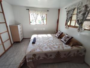 Postel nebo postele na pokoji v ubytování HAUHITI Lodge