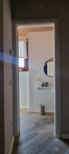 an open door to a room with a mirror at Le Contrade in Amelia +55 photos