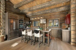 a kitchen with wooden walls and a wooden ceiling at Cabin With Panoramic View Over Hardangervidda in Dagali